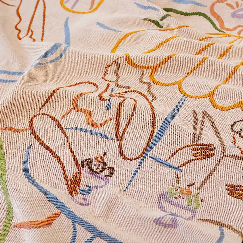 woven fabric with colorful abstract of women eating icecream designs on a beige background