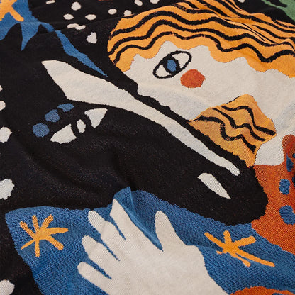 Alma Throw - Slowdown Studio. Colorful woven throw blanket tapestry with abstract folk design of a woman, horse, stars, and flowers on a black background