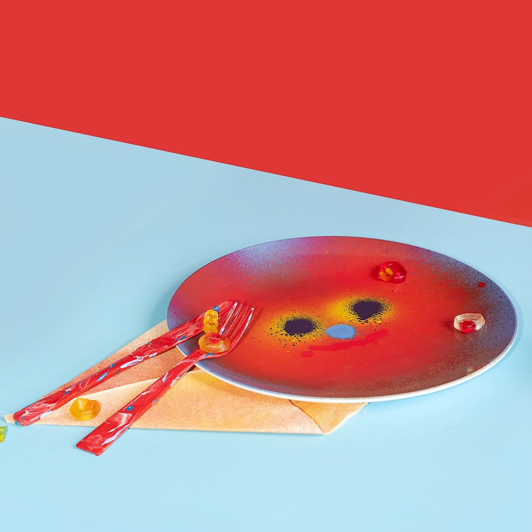 Melamine plate with face designed by artist Jon Burgerman