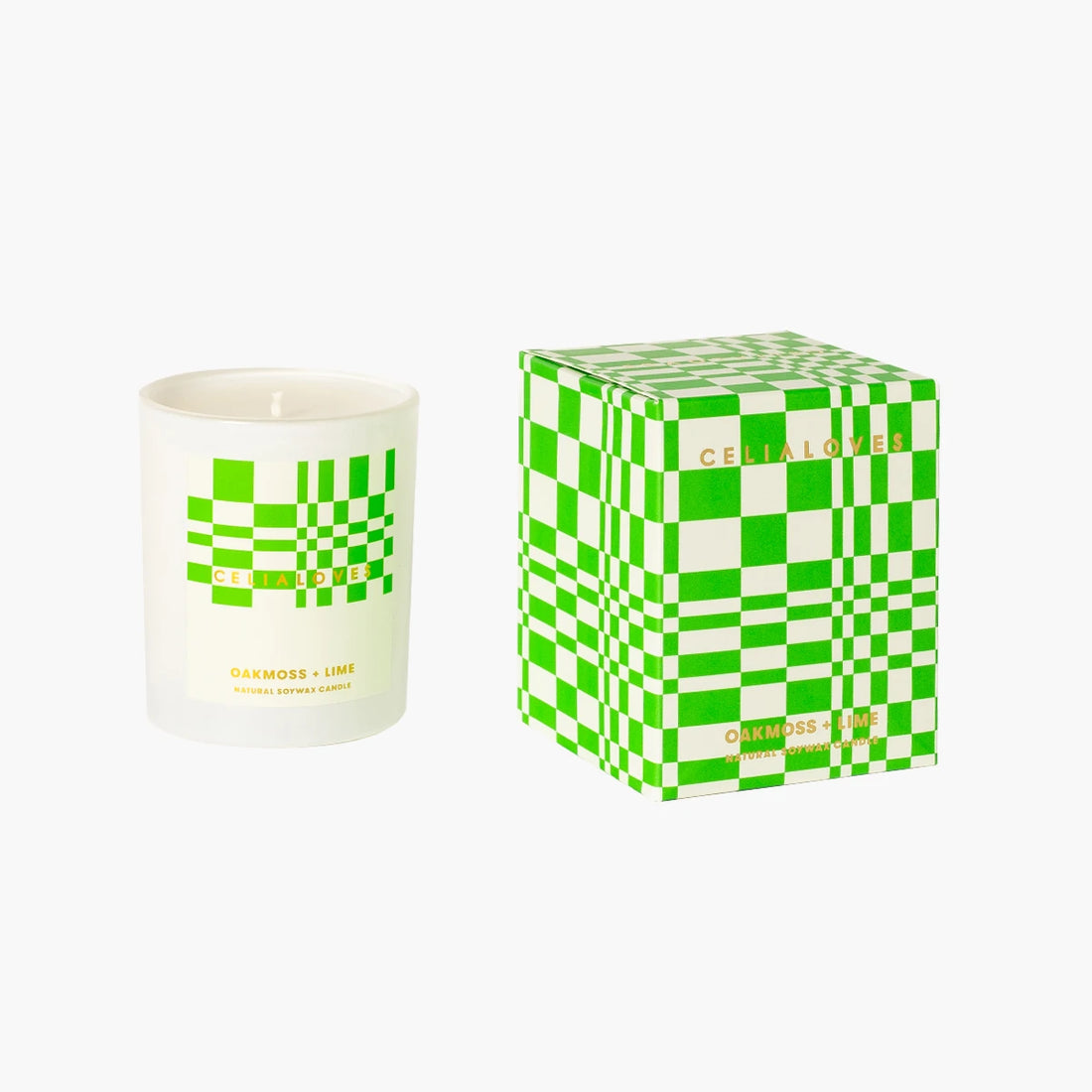 Candle with green and white checkered design next to its box on a white background