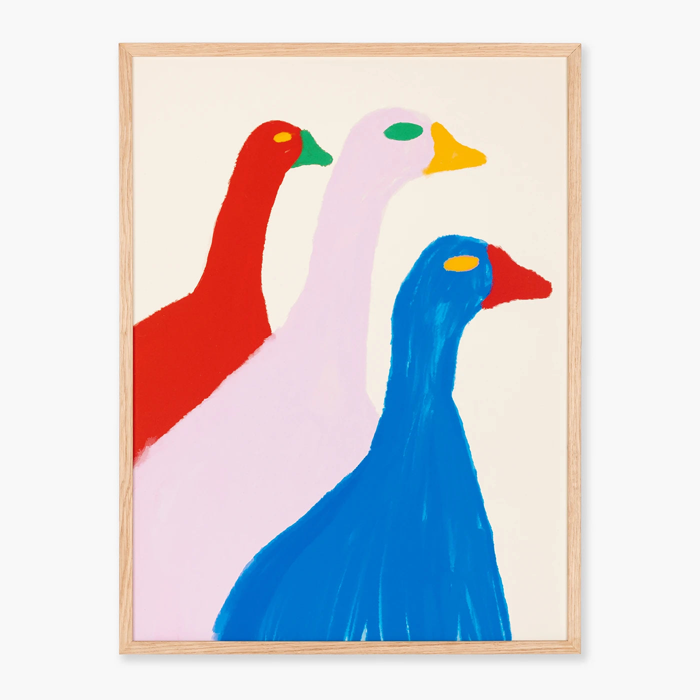 Wall art featuring three abstract goose figures in red, pale pink, and blue on a cream background, enclosed in a light natural wood frame.