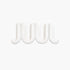 A white, wavy, three-dimensional Heller Swell Wall Catchall on a plain white background.