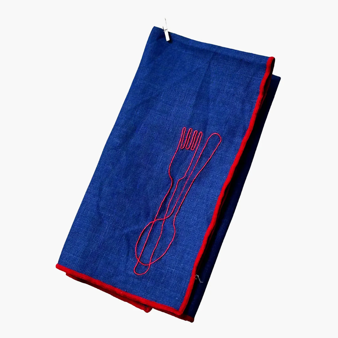 Blue napkin with red outline of a fork and spoon on a white background