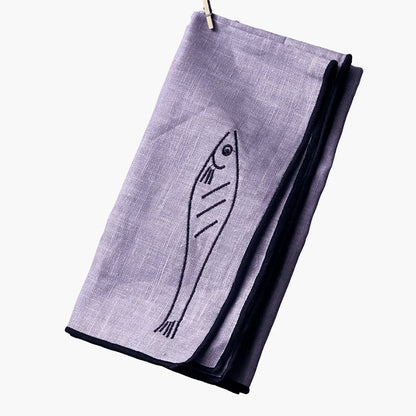 Purple napkin with fish design on a white background