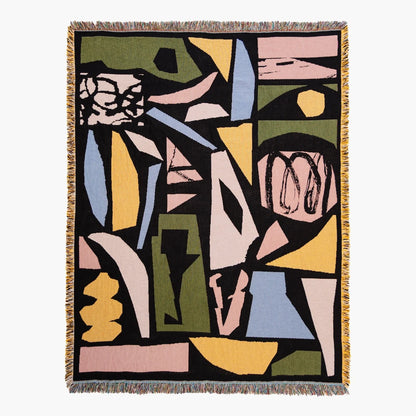 Abstract woven blanket with artwork of geometric shapes on a black background
