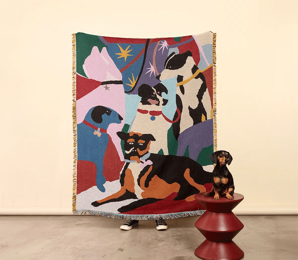 Colorful artist-designed jacquard woven throw by Slowdown Studio in collaboration with one of their Slowdown comp winners, artist Hernan di Fillipo. The blanket features colourful dog illustrations and can be draped on a couch or hung up as wall art for visual impact.