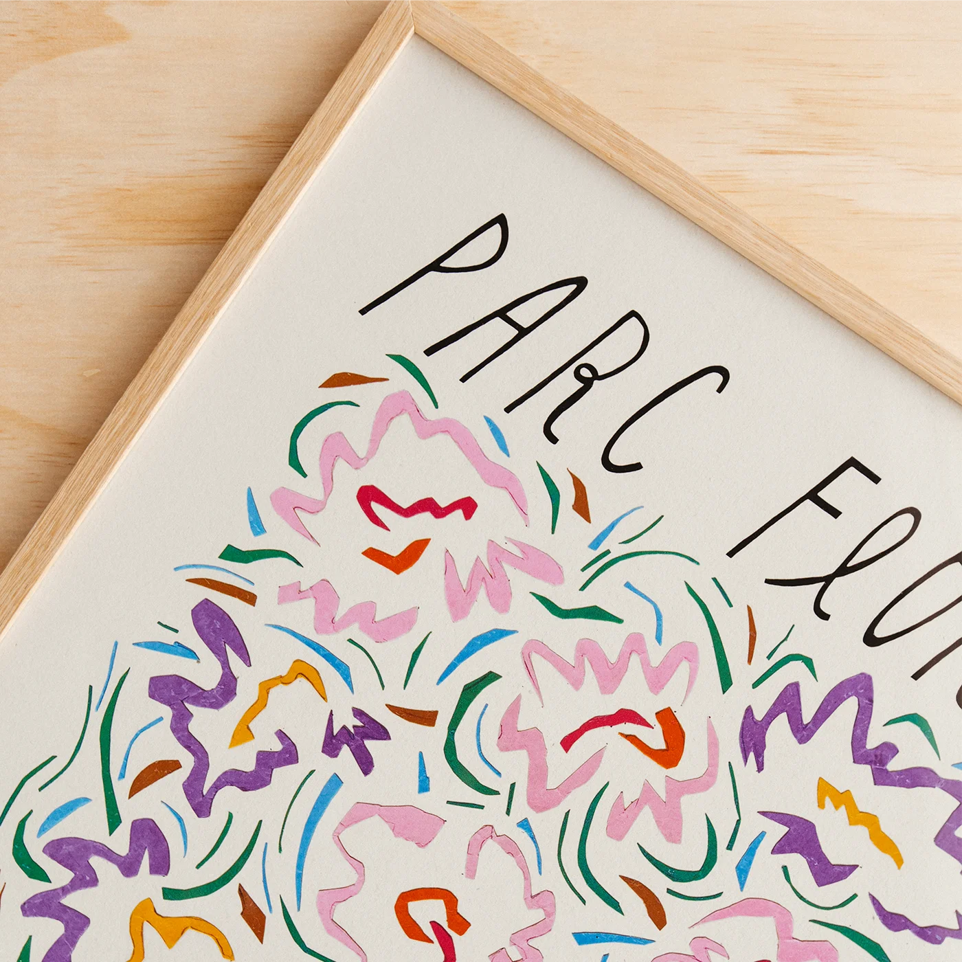 A framed art print featuring a colorful abstract floral illustration with the handwritten text &