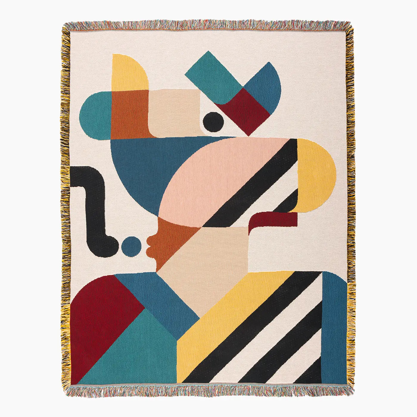 Slowdown Studio Pierre woven throw blanket with fringe on all sides, featuring an abstract geometric design in teal, mustard yellow, peach, burgundy, black, and cream on a light beige background.