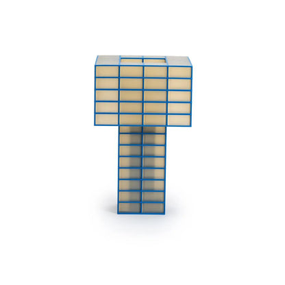 A Ridezign Tesser 5:8 Lamp made of translucent beige panels framed by a bright blue grid, shown on a plain white background.
