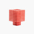 A Ridezign Tesser 8:3 Lamp in Cherry with grids and squares on a white background.